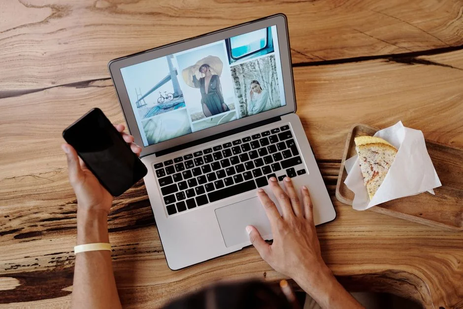 A modern workspace featuring dual computer monitors displaying web design projects, emphasizing technology and productivity.